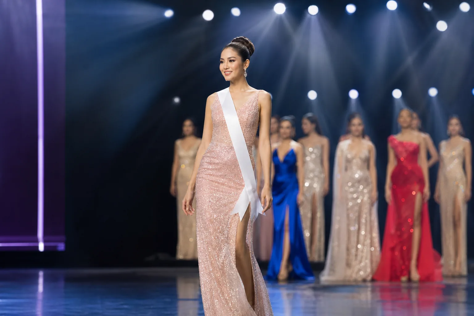 Pageant stage with a runway, crystal lights and a row of empty chairs for the jury
